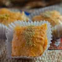 Pistachio Baklava · Buttery, flaky phyllo dough soaked in honey and sugar, stuffed and topped with tender pistac...