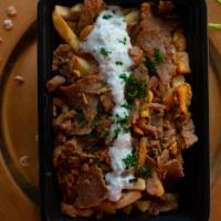 Lamb/Beef Shawerma Fries  · Think Carne Asada but better! Crispy golden fries topped with lamb/beef shawerma and our hom...