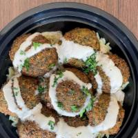 Falafel Bowl  · Bowl filled with rice topped with our freshly made falafel and our homemade tahini sauce