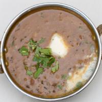 Dal Makhni · Creamed black lentils cooked over a slow fire with fresh tomatoes and exotic spices.
