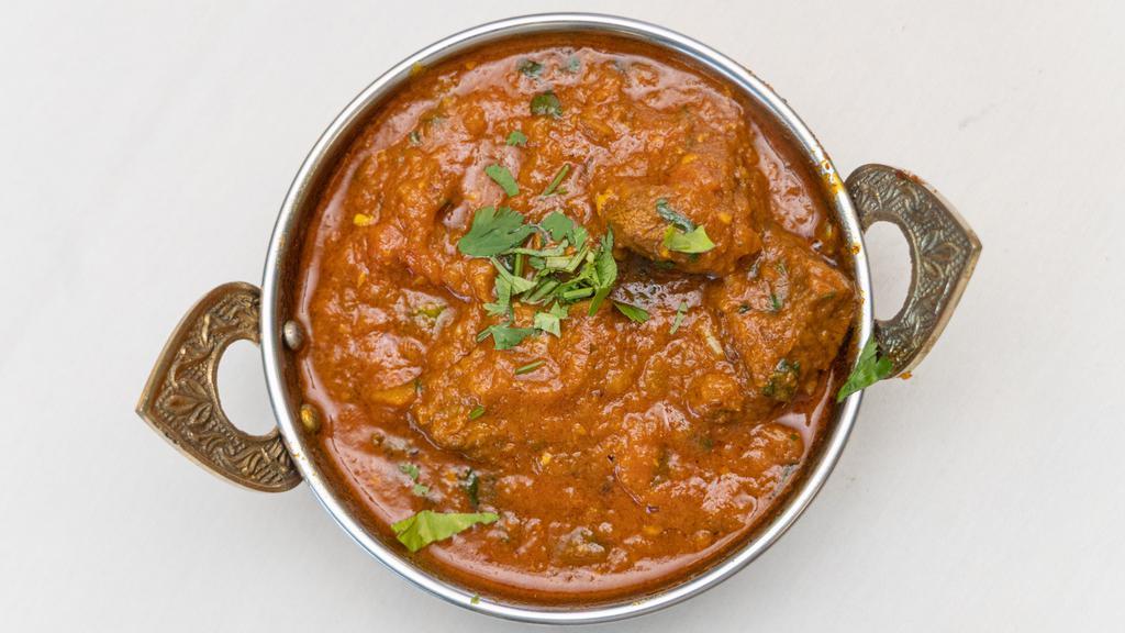 Lamb Curry · Lamb cooked in a traditional, mildly spicy curry masala.