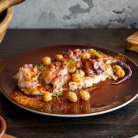 Pulpo · Slow-cooked octopus, piquillo peppers, pickled onions, garbanzo bean purée.