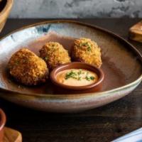 Croquetas de Pollo · Roasted chicken and Gruyere croquette served with spicy mojo picón.