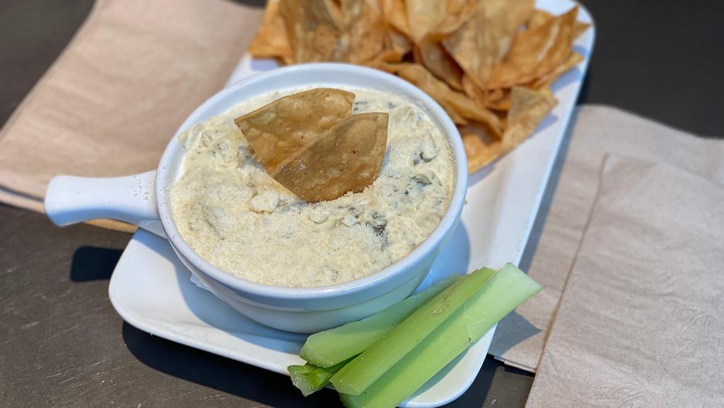 Spinach + Artichoke Dip · Artichoke, Spinach, Cream Cheese, Sour Cream, Onion, Garlic, Parmesan cheese. Served with Celery & housemade Tortilla chips