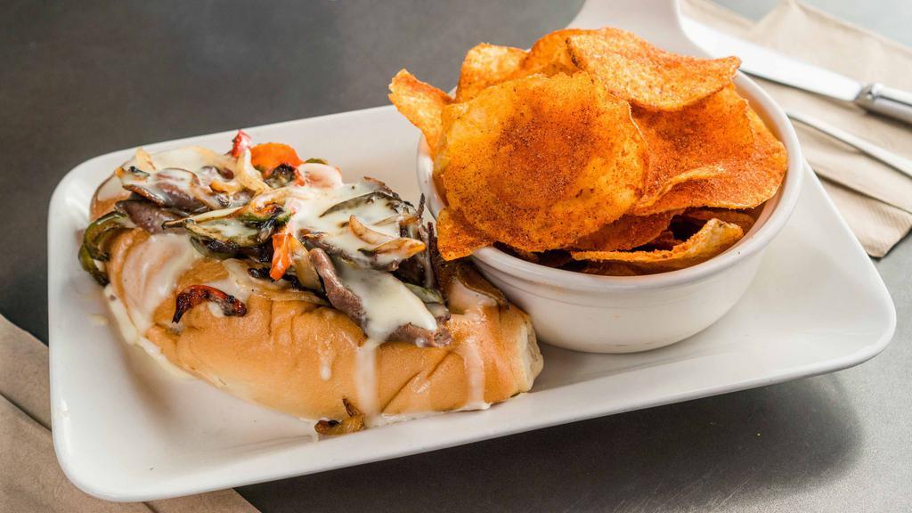 Philly Cheesesteak · Thinly Sliced Steak, Onions, Bell Peppers, Cheddar Cheese Sauce, Torpedo Roll