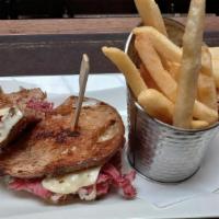 Reuben Rock SF Style · 5oz of Grilled Corned Beef, Sauerkraut, Swiss Cheese & Thousand Island Dressing on Sliced So...