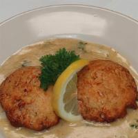 Crab Cakes · Handmade Dungeness crab cakes, grilled and served with a lemon butter sauce