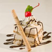Tiramisu · Our homemade Italian temptation, combining ladyfingers laced with rum and espresso, layered ...