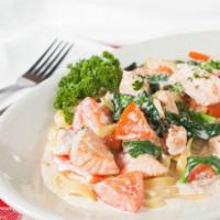 Fresh Salmon Florentine · Pieces of fresh salmon sautéed with garlic, butter, shallots, fresh tomatoes and spinach in ...