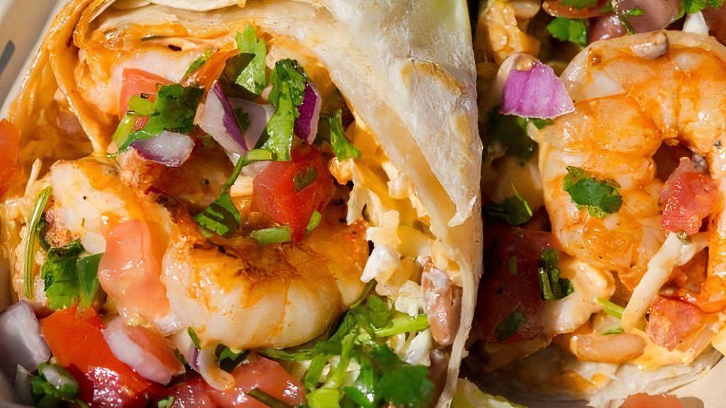 Cabo Burrito · Shrimp burrito: grilled shrimp, Monterey cheese, onions cilantro, bell peppers rice beans guacamole sour cream red salsa.