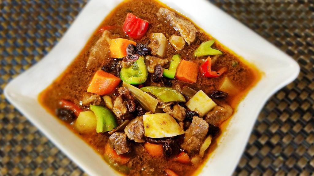 Pork Menudo (32oz) · Not the Mexican kind but the Filipino style.  Pork cubes, carrots, potato and peppers braised in tomato sauce & banana ketsup