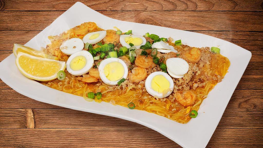 Pancit Palabok · Thin Rice noodles with mixed seafood rich sauce.