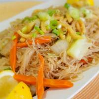 Pancit Canton · Cantonese style noodles wok fried with chicken, shrimp & veggie .  Flavored with sesame oil