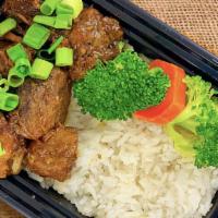 Budget Lunch Pork Adobo · Pork braised in garlic, soy sauce and vinegar with choice of white rice or noodles and seaso...
