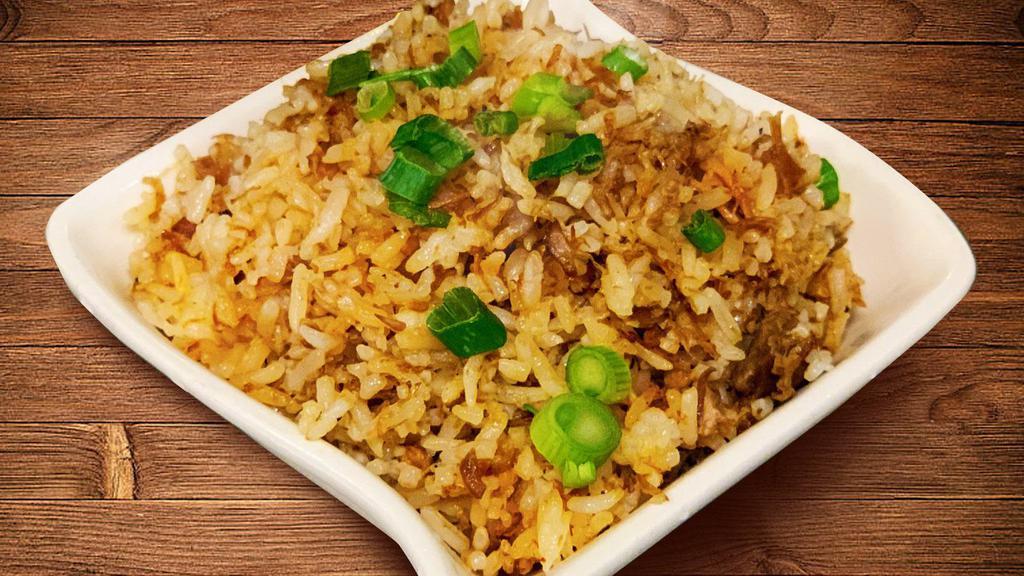 Adobo Rice (32oz) · Family Size 32oz adobo flavored fried rice.  Bits of chic adobo meat may be present