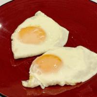 Fried Eggs · 2 fried eggs.  Sunny side up