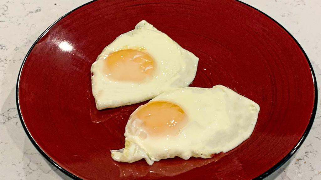 Fried Eggs · 2 fried eggs.  Sunny side up