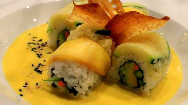 The Veggie Roll · Asparagus, cucumber, avocado, carrot topped with mango and tempura zucchini  sesame seeds with house special sauce