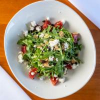 Beet Salad · Wild arugula, roasted beets, goat cheese, dried currants, toasted almonds, strawberry vinaig...