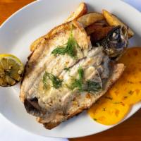 Grilled Whole Trout · Grilled trout, roasted garlic potatoes,  herb heirloom tomatoes, grilled lemon