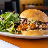 Buffalo Chicken Sandwich · Fried chicken breast, homemade buffalo sauce, cabbage slaw, served with mix green salad.