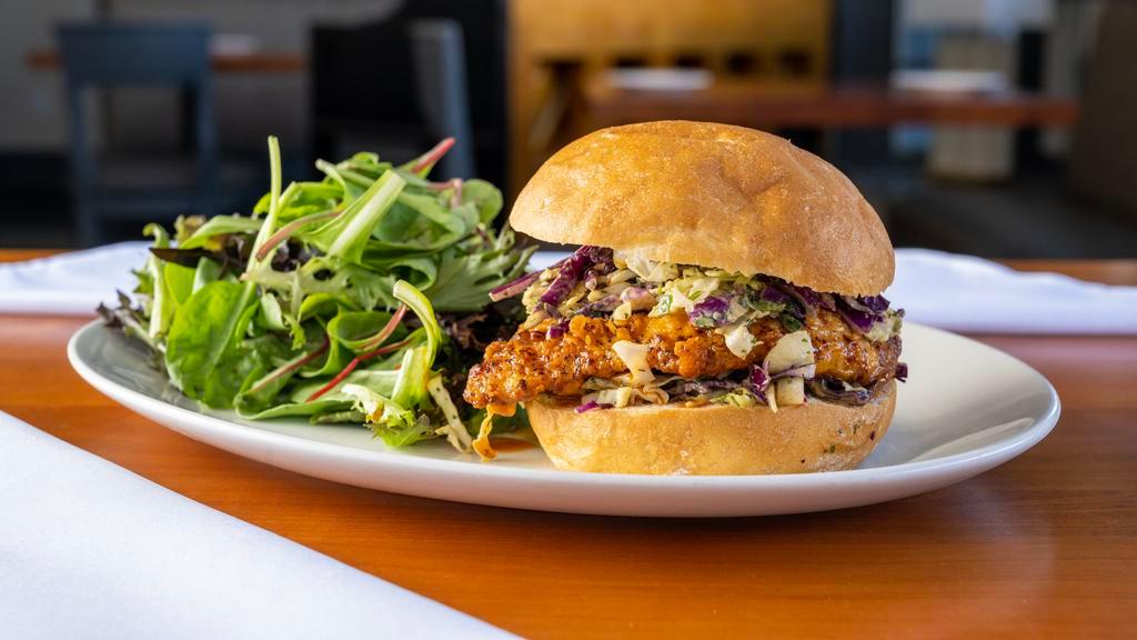 Buffalo Chicken Sandwich · Fried chicken breast, homemade buffalo sauce, cabbage slaw, served with mix green salad.