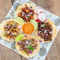 1. Street Taco · Corn Tortilla, Choice of Meat, Onion & Cilantro, Radish, Limes, and Salsa.