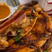 Loaded  Baja Taco · Birria, Shrimp, Cheese Onion Cilantro.