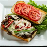 Lamb Philly Cheese · Lamb, Mozzarella  Cheese, Bell Pepper, Onion, Mushroom, Tomato & Mayo on a French Roll