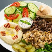 Mixed Shawarma Plate · Shredded Beef topped with Tahini Sauce & Shredded Chicken topped with Garlic Sauce, Pickles ...
