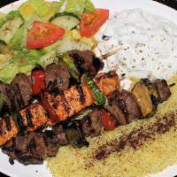 Mixed Kabab Plate · 3 Skewers Lamb, Beef & Chicken Cubes served with Rice, Green Salad & Taziki