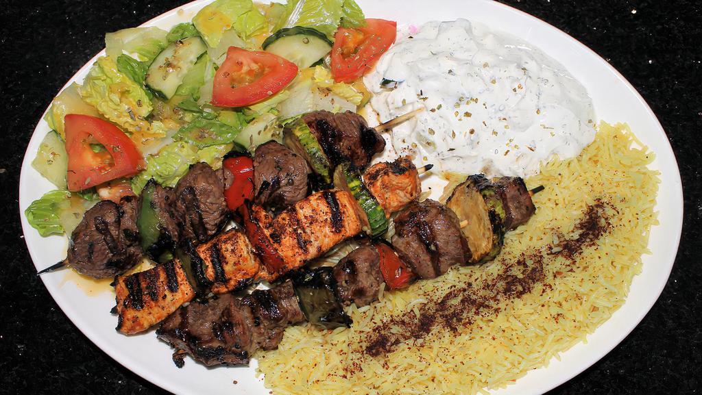Mixed Kabab Plate · 3 Skewers Lamb, Beef & Chicken Cubes served with Rice, Green Salad & Taziki