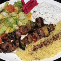 Lamb Kabab Plate · 2 Skewers Lamb Cubes served with Rice, Green Salad & Taziki