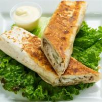 Chicken Shawarma Wrap · Shredded Chicken, Pickles, Red Onions & Garlic Sauce wrapped in Lavash. Pressed on the Grill.