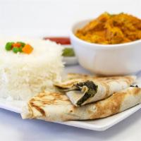 Chicken · Served with basmati rice chutneys and roti.