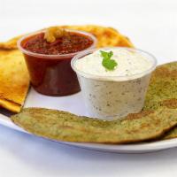 Lentil Roti · Two roti's with two sides of sauce or chutney.