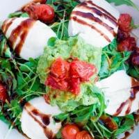 Caprese Salad · Imported Bufala Mozzarella,. Roasted Tomatoes, Pesto,. Avocado, Balsamic Glaze on Bed of. Se...