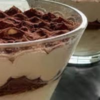 Tiramisu · Coffee and Zabaione cream on a layer of sponge cake soaked in espresso, dusted with cocoa po...