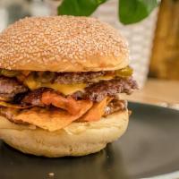 Burger · A juicy 6 oz. burger served on a perfect brioche bun with caramelized onions, chipotle remou...