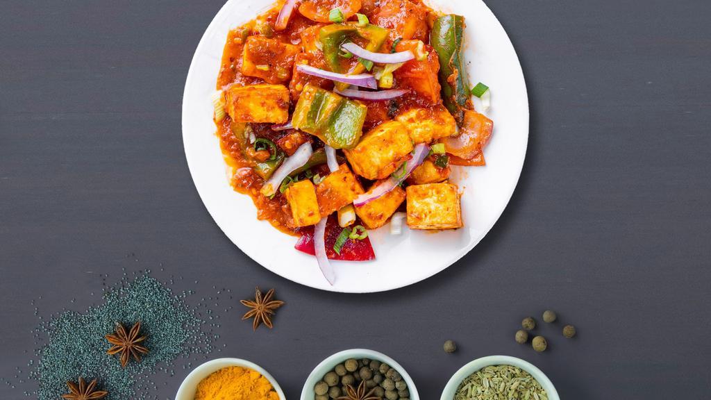 Paneer Chili · Marinated paneer cooked with house chili sauce, peppers, and onions