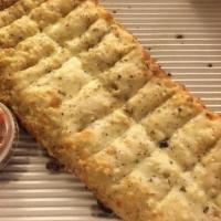 Parmesan Breadsticks · With marinara sauce.