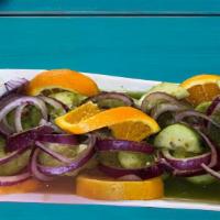 Aguachiles · Raw Shrimp Marinated (Cooked) In Lime Juice, Onions, Jalapenos, Cucumbers.