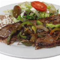 Carne Asada · Grilled flank steak. Includes rice, beans and salad.