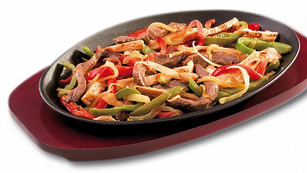 Fajitas/Elegir Uno Articulo · One chose of meat. Includes tortillas, rice, beans, sour cream, guacamole, onions and bell peppers.