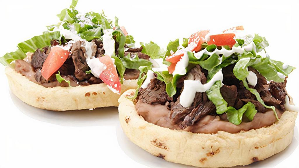 Sopes · Thick round fried tortilla. Choice of meat, beans, sour cream, salsa, lettuce, tomato Mexican cheese.