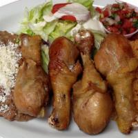 Pollo Dorado/Fried Chicken Legs · Comes with rice, beans and salad