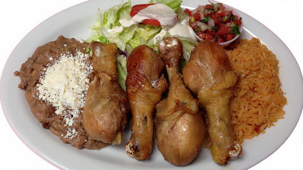 Pollo Dorado/Fried Chicken Legs · Comes with rice, beans and salad