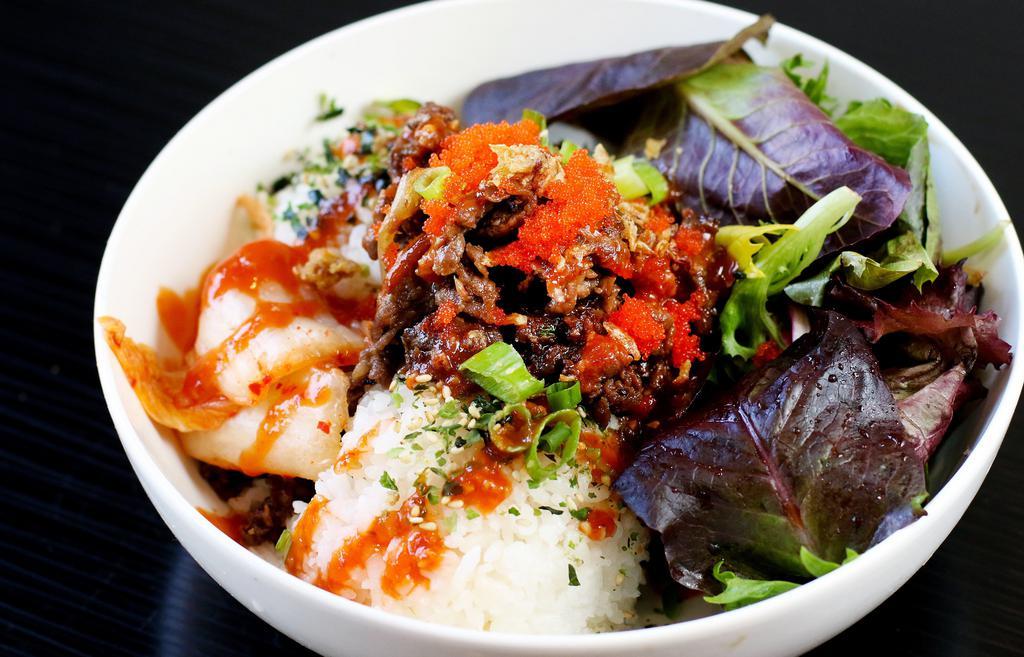 Beef Bowl · Korean BBQ bowl, sauteed onions, kimchi, masago, red sauce, green onions, fried shallots, and sesame seeds. Served over your choice of white or brown furikake seasoned rice. Comes with a side of vinaigrette spring mix. Gluten-free option available.