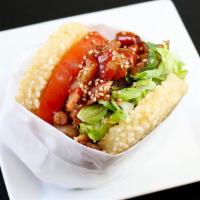 Chicken KoJa · Korean BBQ chicken, sesame vinaigrette lettuce, tomato, cilantro, spicy gochujang sauce, ses...