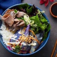 Buddha Belly Bowl · Vegetarian. Japanese eggplant, mochiko mushrooms, julienne carrots, shaved cabbage, kale and...